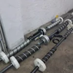 galería - Muelles de torsión montados en ejes con tambores y placas de apoyo.